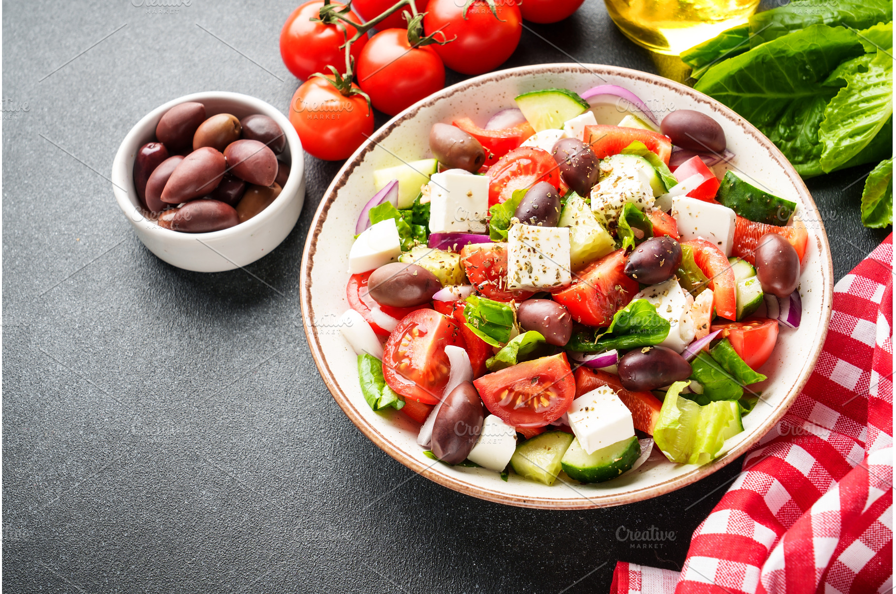 Greek salad in craft plate on black, a Food & Drink Photo by Nadia-nb