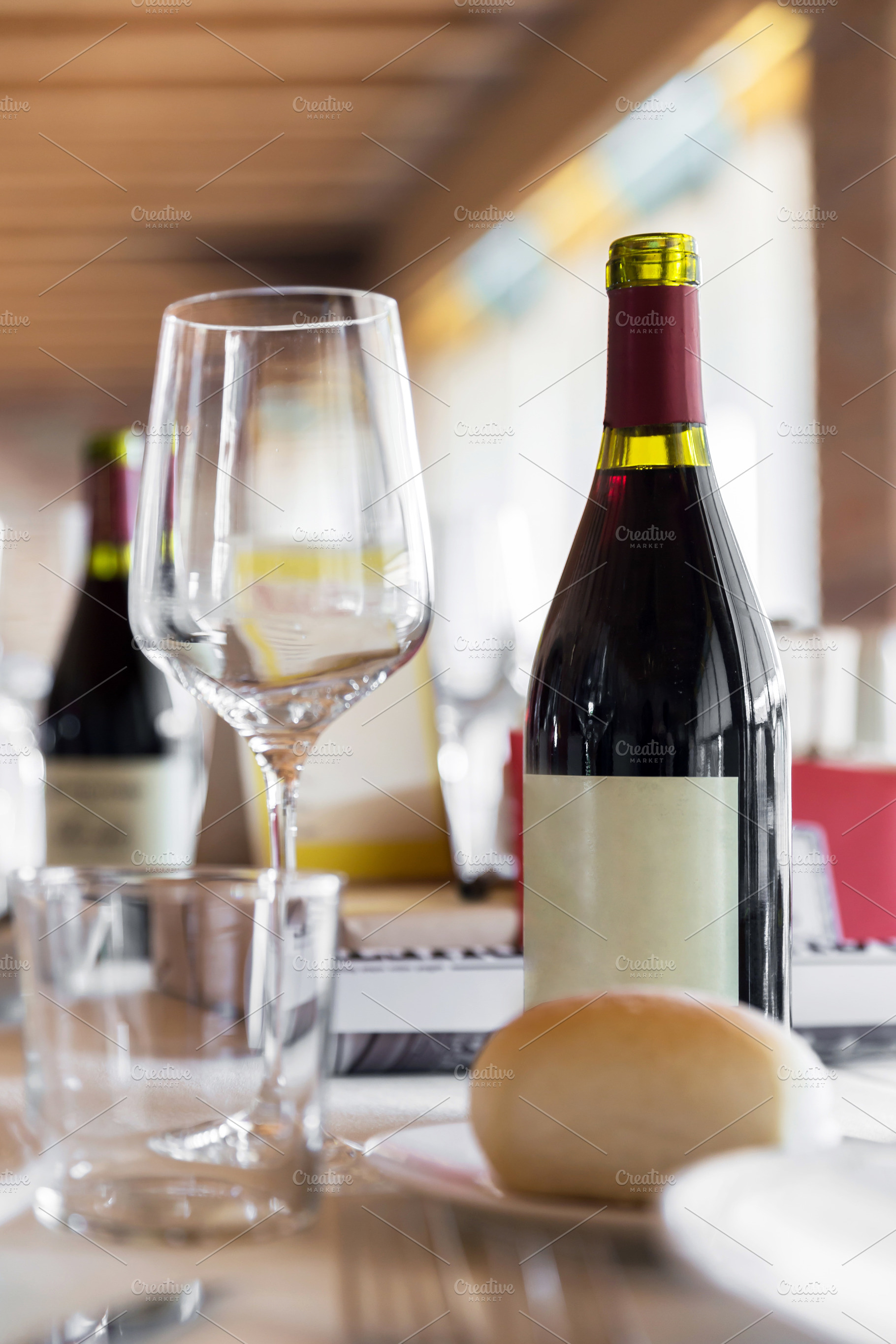 Elegant Wine Glass with Wine on a Ta, a Food & Drink Photo by KYNA STUDIO
