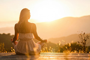 Woman Meditating at Golden Sunset in Nature, a Person Photo by Davizro's Market