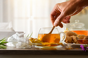 Preparing a ginger and honey infusion to combat cold symptoms, a Food & Drink Photo by Davizro's Market