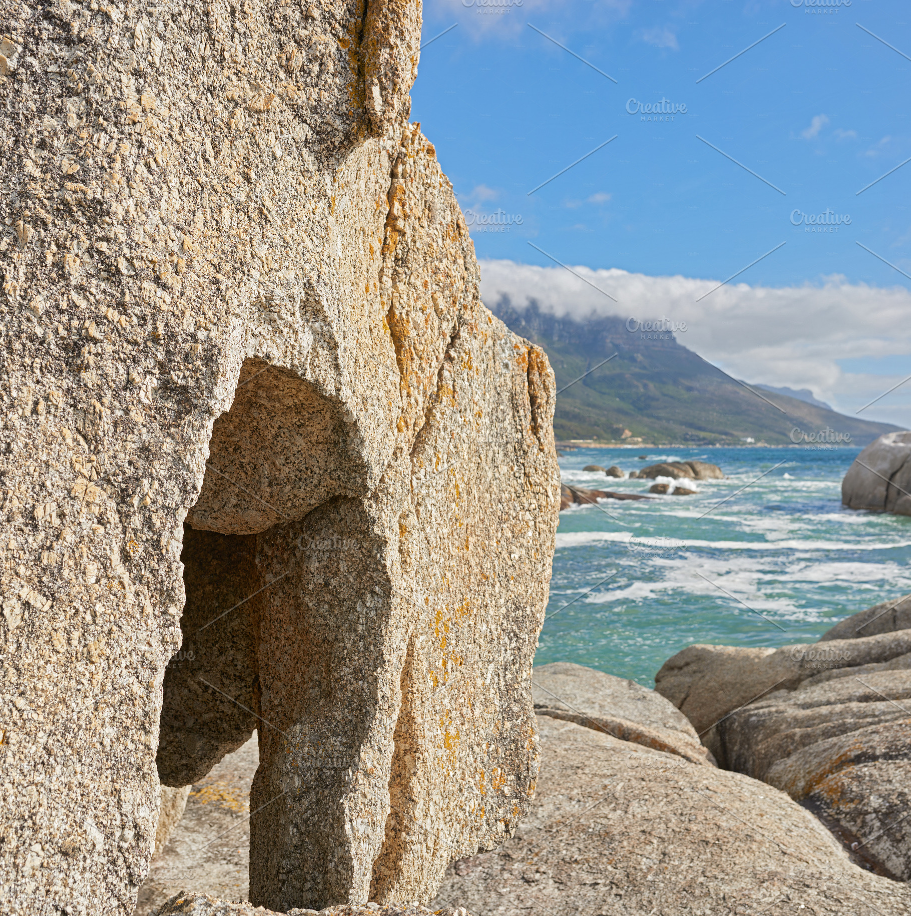 Rocky coastline of the Camp¬¥s Bay, Western Cape, a Photo by Peopleimages.com