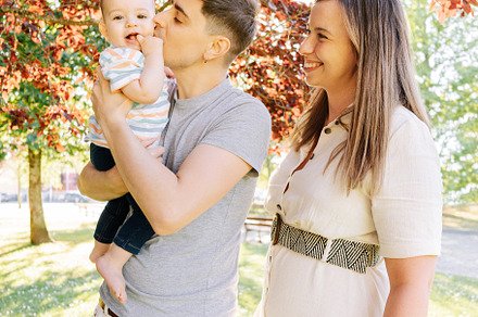 Portrait of a young family with their nine month old baby