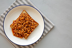 Homemade English Beans on Toast, top view. Copy space., a Food & Drink Photo by LiudmylaChuhunova