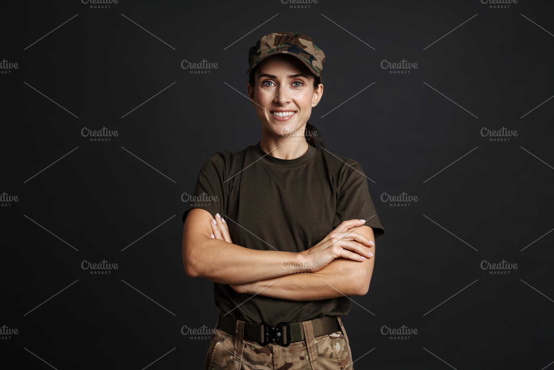 Happy beautiful soldier woman standing isolated, a Person Photo by Dean Drobot