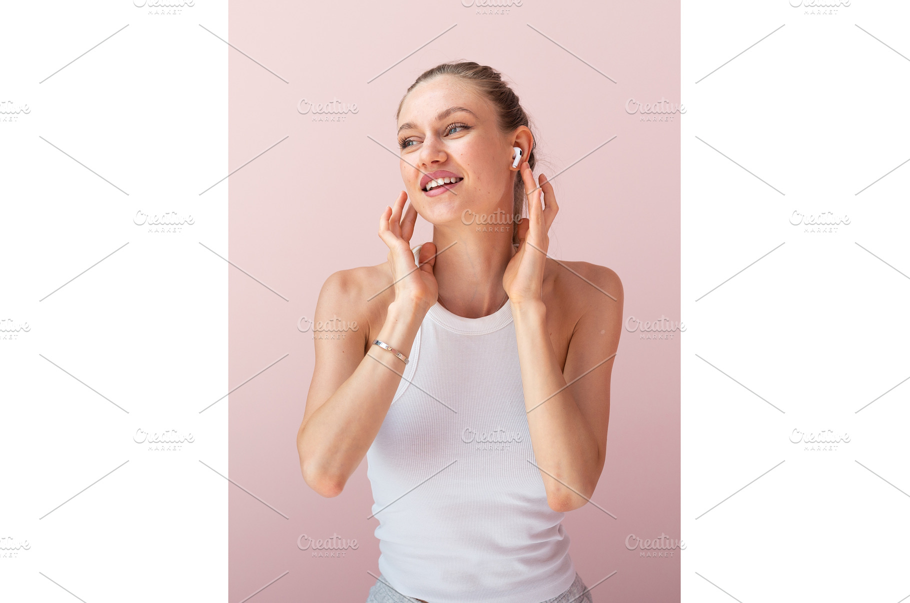 Smiling woman in earbuds feeling the, a Beauty & Fashion Photo by undrey