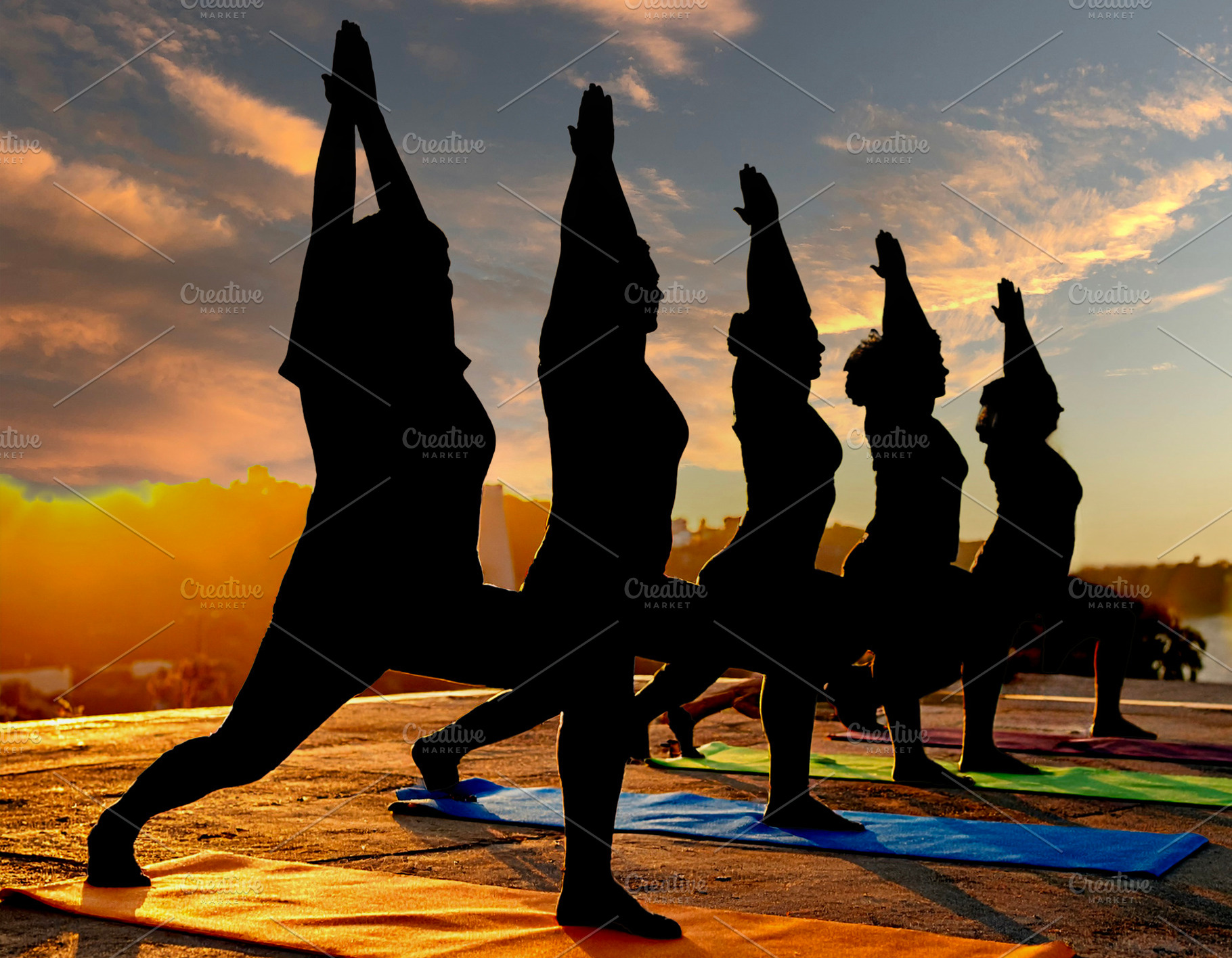Diverse group practicing yoga at nature, a Health & Medical Photo by DanFLCreativo