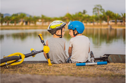 Two boys sit on the shore of the, a Sports & Recreation Photo by Elizaveta Galitskaya