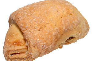 Freshly baked croissant with filling, generously sprinkled with, a Food & Drink Photo by ndanko