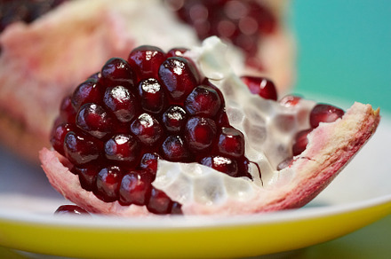 Natural antioxidant, healthy pomegranate seeds. Close up of raw red ripe pomegr, a Food & Drink Photo by Rohan Photography
