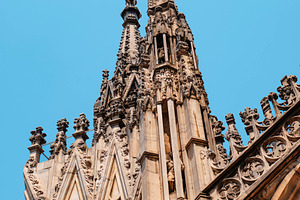 gothic spires and statues of the Duomo di Milano, a Photo by Nito