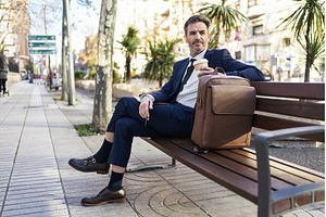 Mature businessman with takeaway
