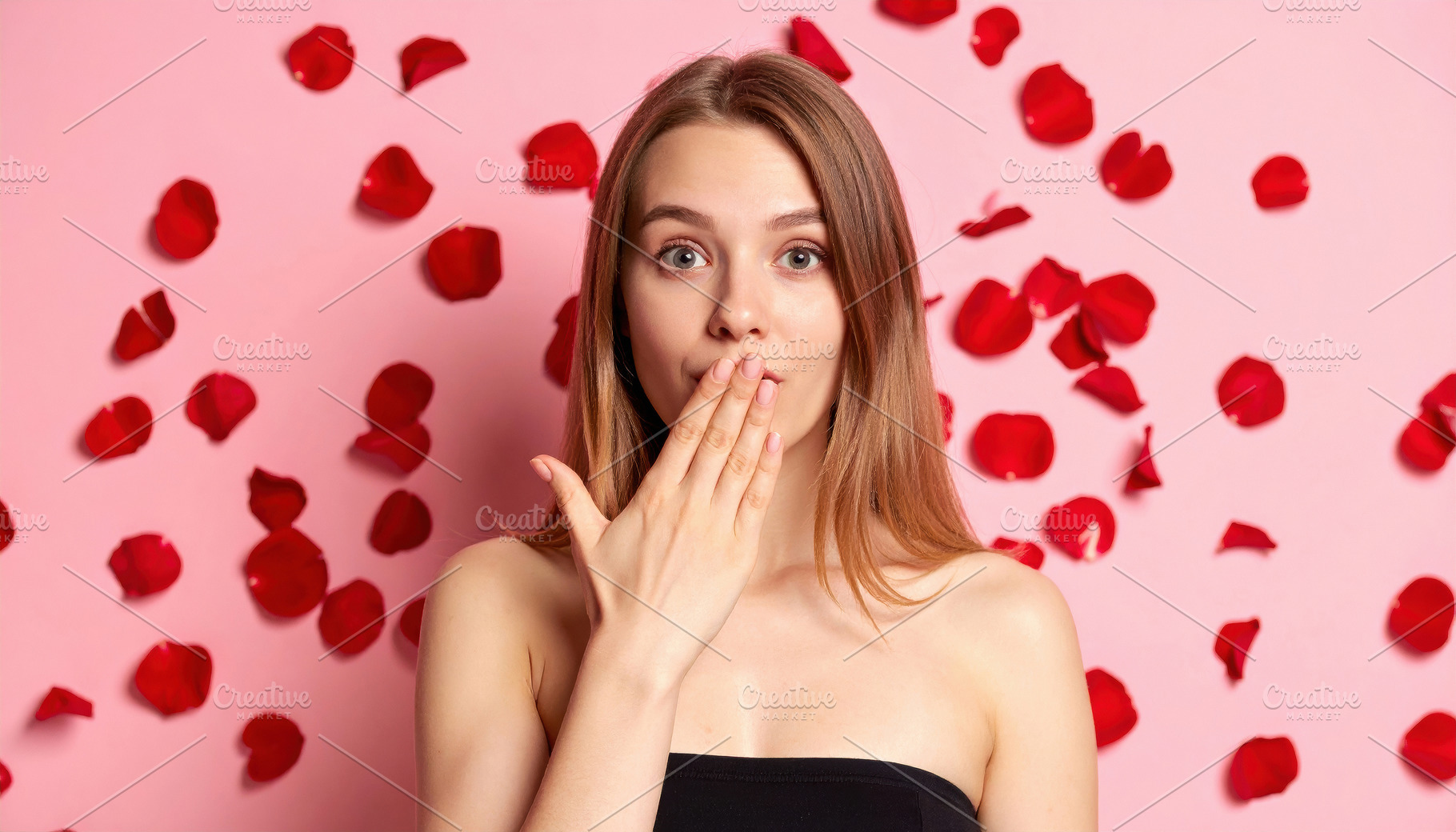 Surprised young woman with rose petals background, a Person Photo by Davizro's Market
