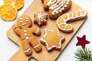 Gingerbread cookies arranged on cutting board with christmas dec, a Holiday Photo by Olena Rudo