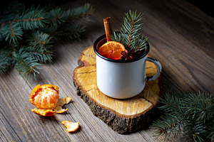 Traditional tasty mulled wine hot drink with mandarin apple spices and christma, a Food & Drink Photo by dashtik