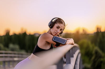 Young woman with headphones resting, a Sports & Recreation Photo by Perpis