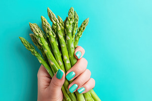 Fresh asparagus bundle with turquoise manicure, a Food & Drink Photo by AlyaAnd