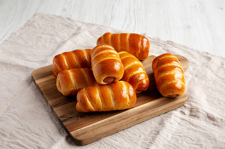 Homemade Kolache Rolls Ready to Eat on a Wooden Board, side view, a Food & Drink Photo by LiudmylaChuhunova