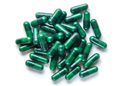 Green capsules, herbal medicines, a Health & Medical Photo by yanadjana