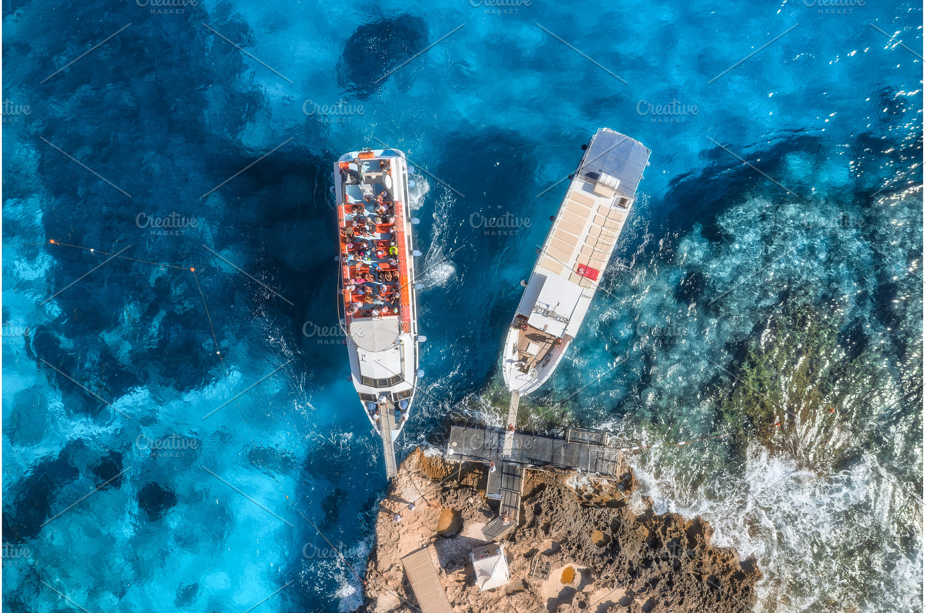 Aerial view of boat and rocky sea, a Nature Photo by den-belitsky
