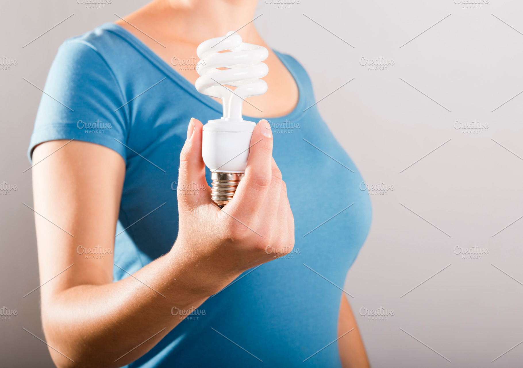 Woman Holding Light Bulb, a Person Photo by THP Creative