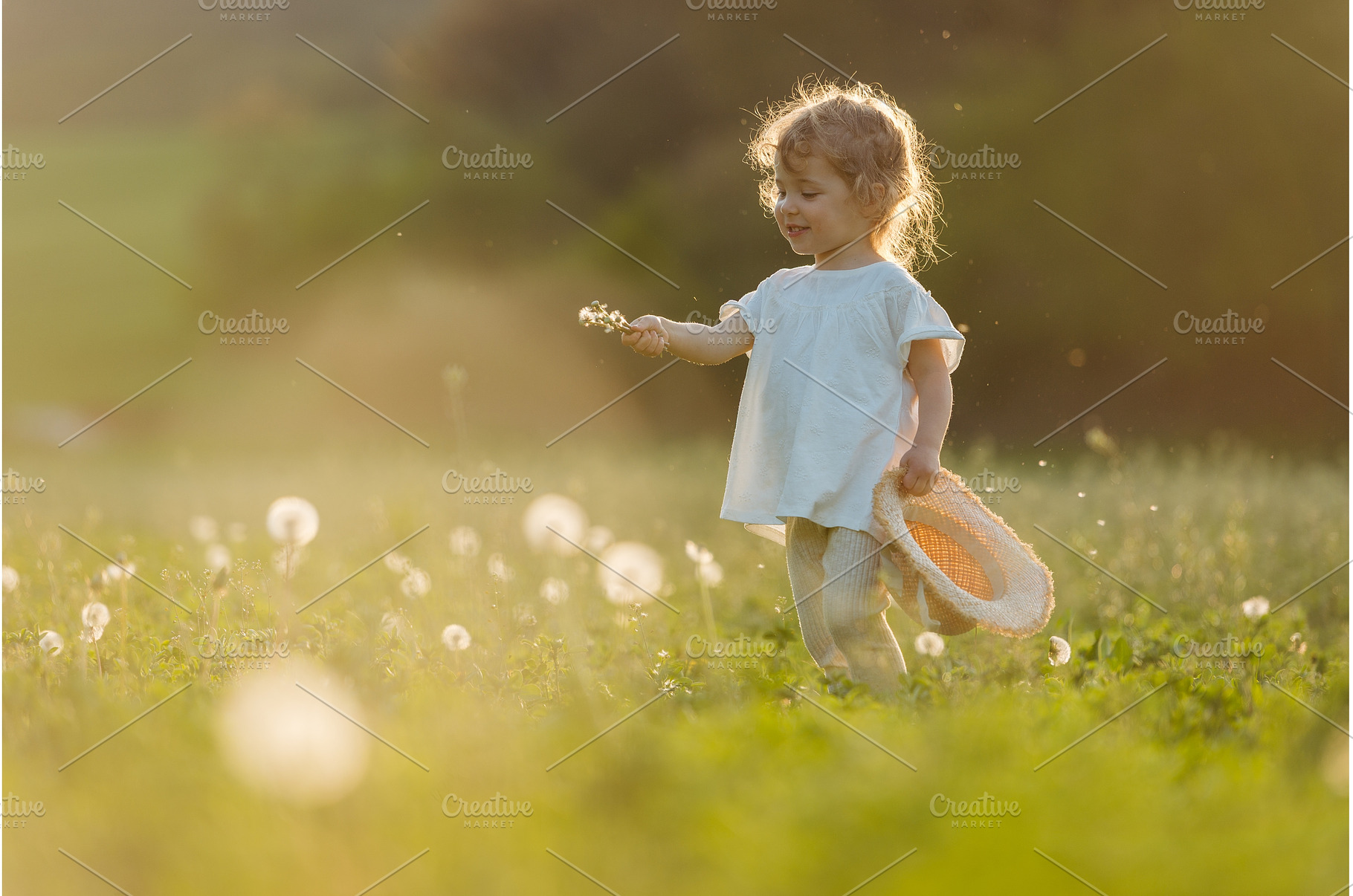 Cute girl playing on meadow, in, a Person Photo by HalfPoint