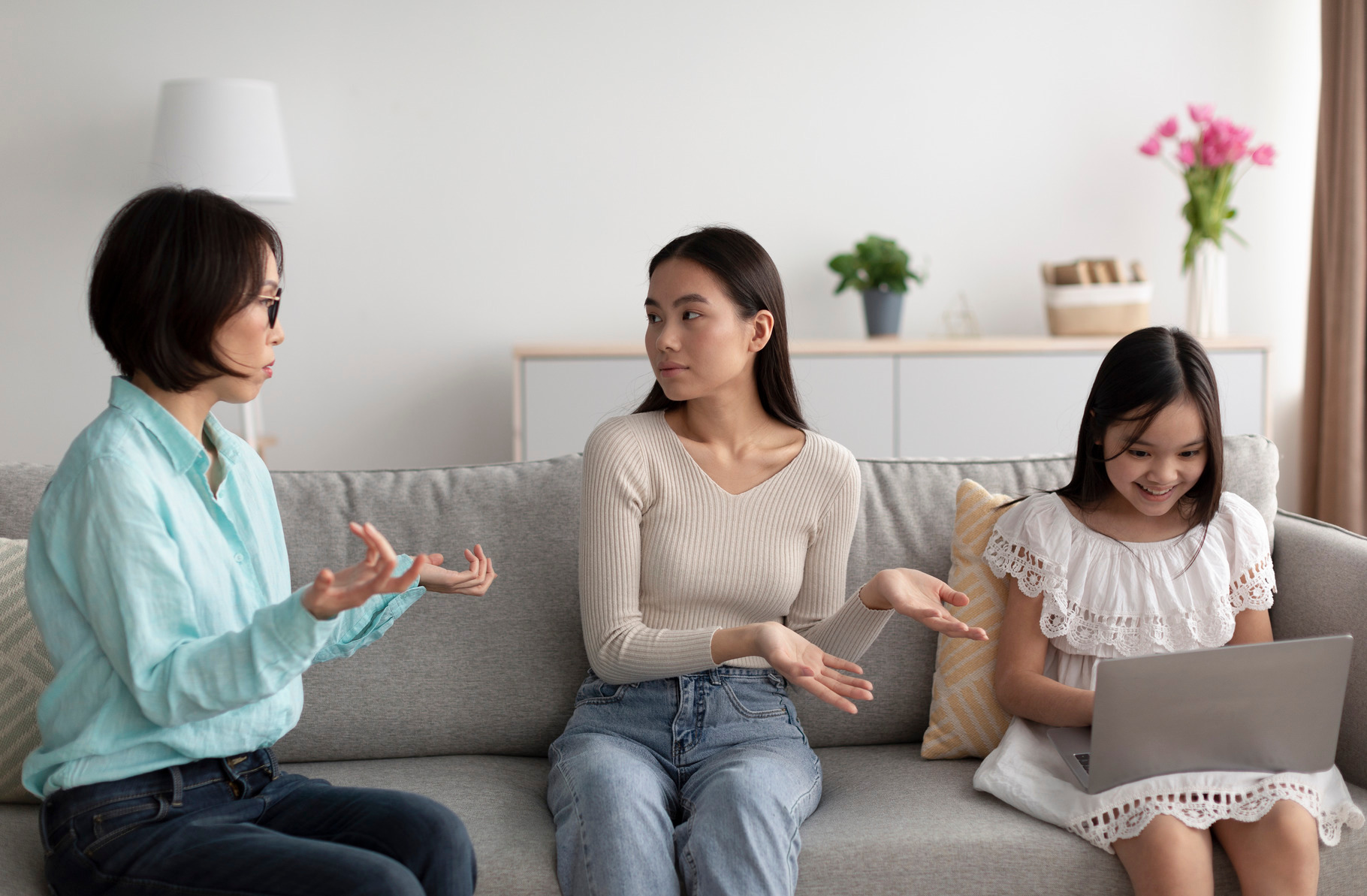 Stressed young Asian woman having conflict with her senior mother about ...