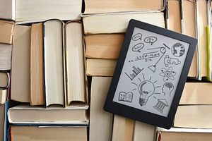 Digital tablet with drawings of school subjects on textbooks, a School & Education Photo by Davizro's Market