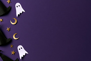 Halloween witch hats and ghosts on purple background, an Abstract Photo by José Manuel Gelpi