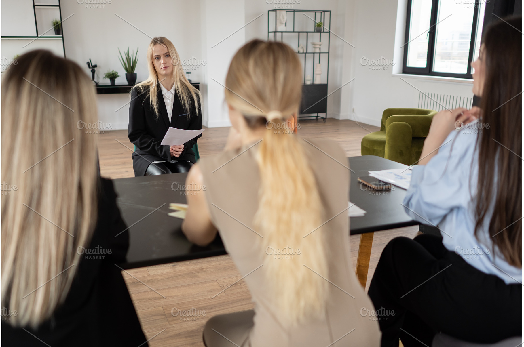 Female candidate listening intently, a Business Photo by undrey
