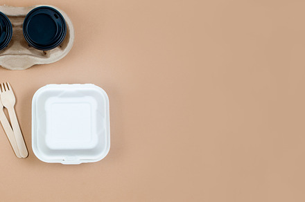 Top view on different eco-friendly disposable kraft  paper table, a Photo by vimart