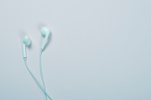Headphones on blue background. Technology.