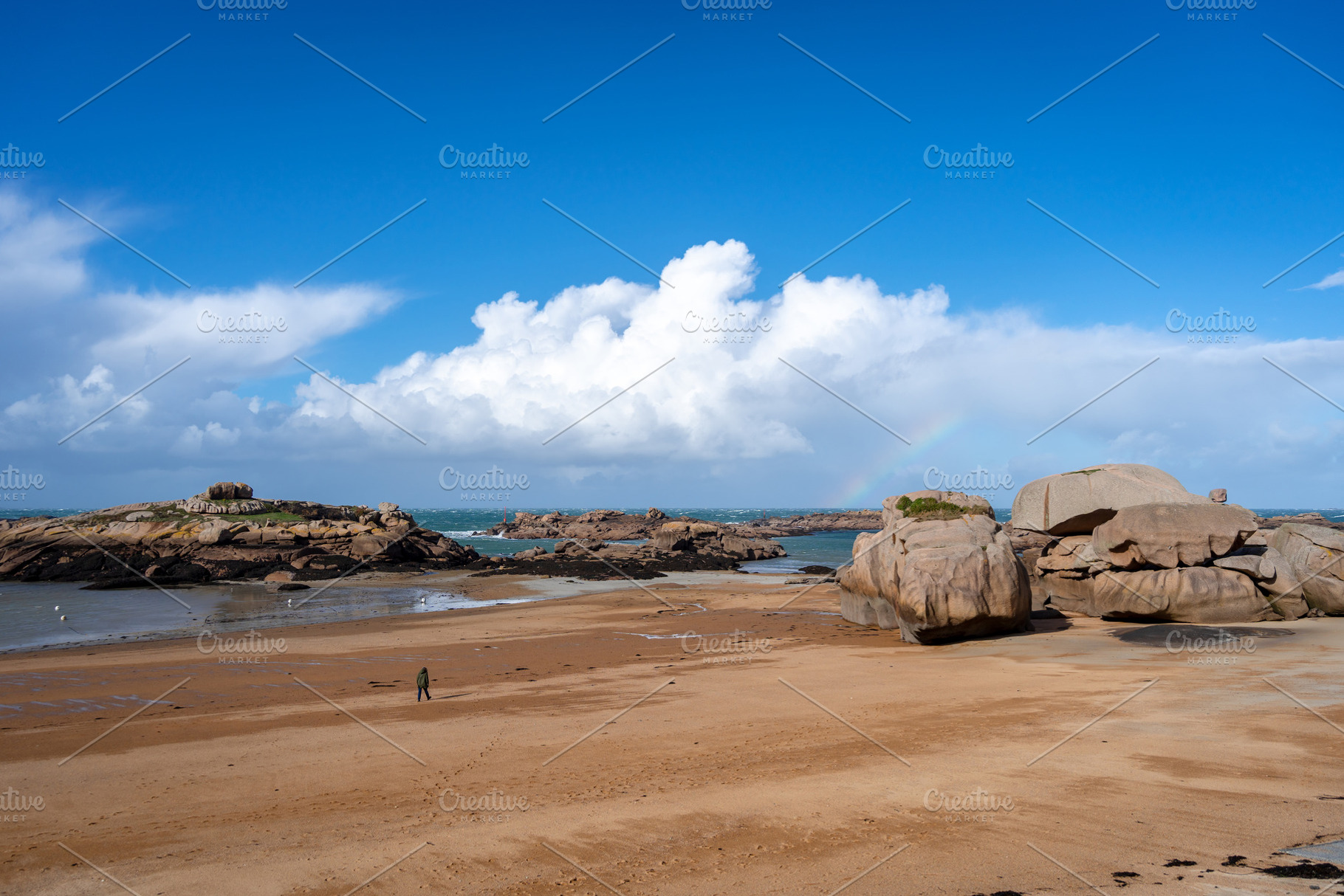 Rocky tidal island under bright skies in Tregastel, Brittany, Fr, a Nature Photo by GoodGoods