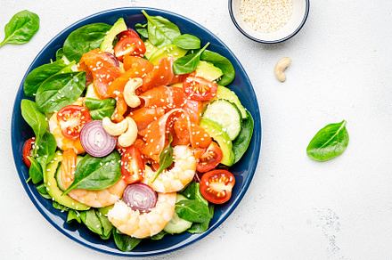 Ketogenic diet salad with salmon, shrimp, avocado, spinach, cucu, a Food & Drink Photo by 5PH