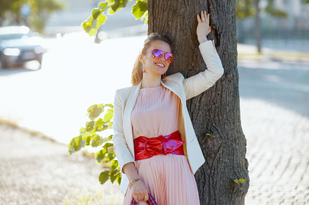 happy stylish 40 years old woman in dress and jacket in city, a Person Photo by Alliance Images