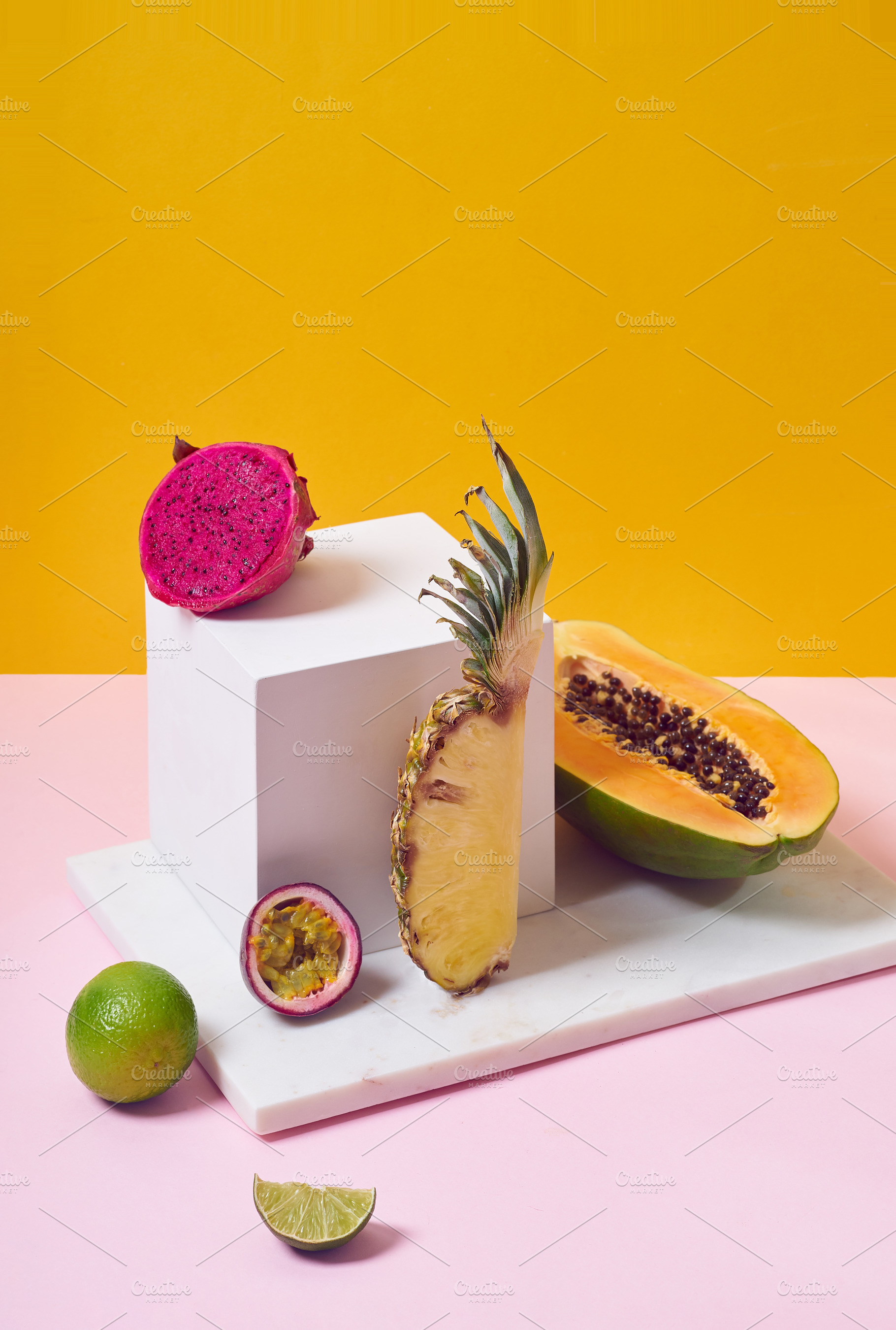 Tropical fruits variety on a colorful background. Side view with, a Food & Drink Photo by Asya Nurullina