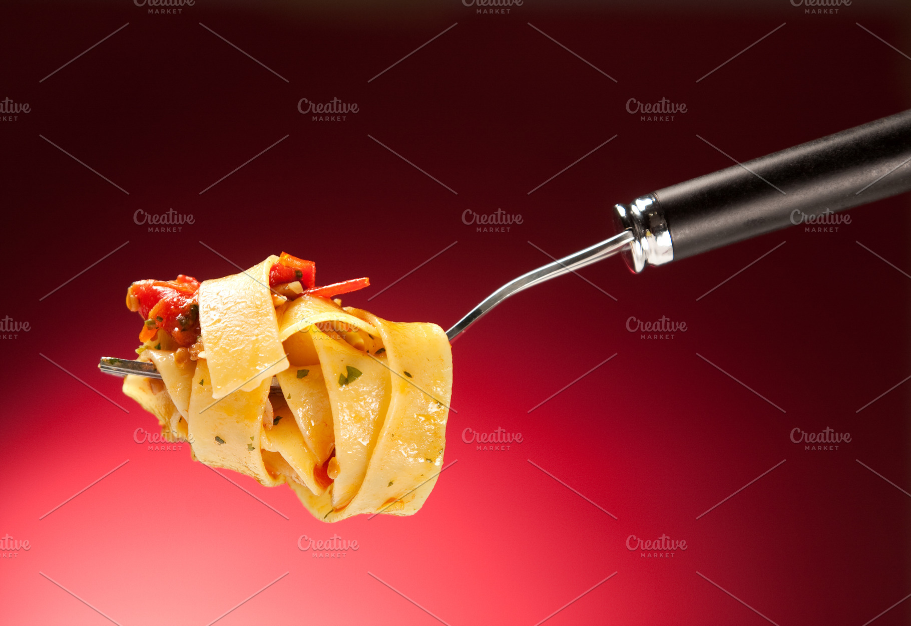 Tagliatelle with clams on a red background, a Food & Drink Photo by FoodStock