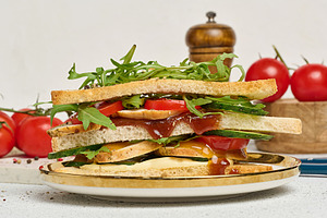 Sandwich with grilled chicken, fresh cucumber, tomato, arugula a, a Food & Drink Photo by ndanko
