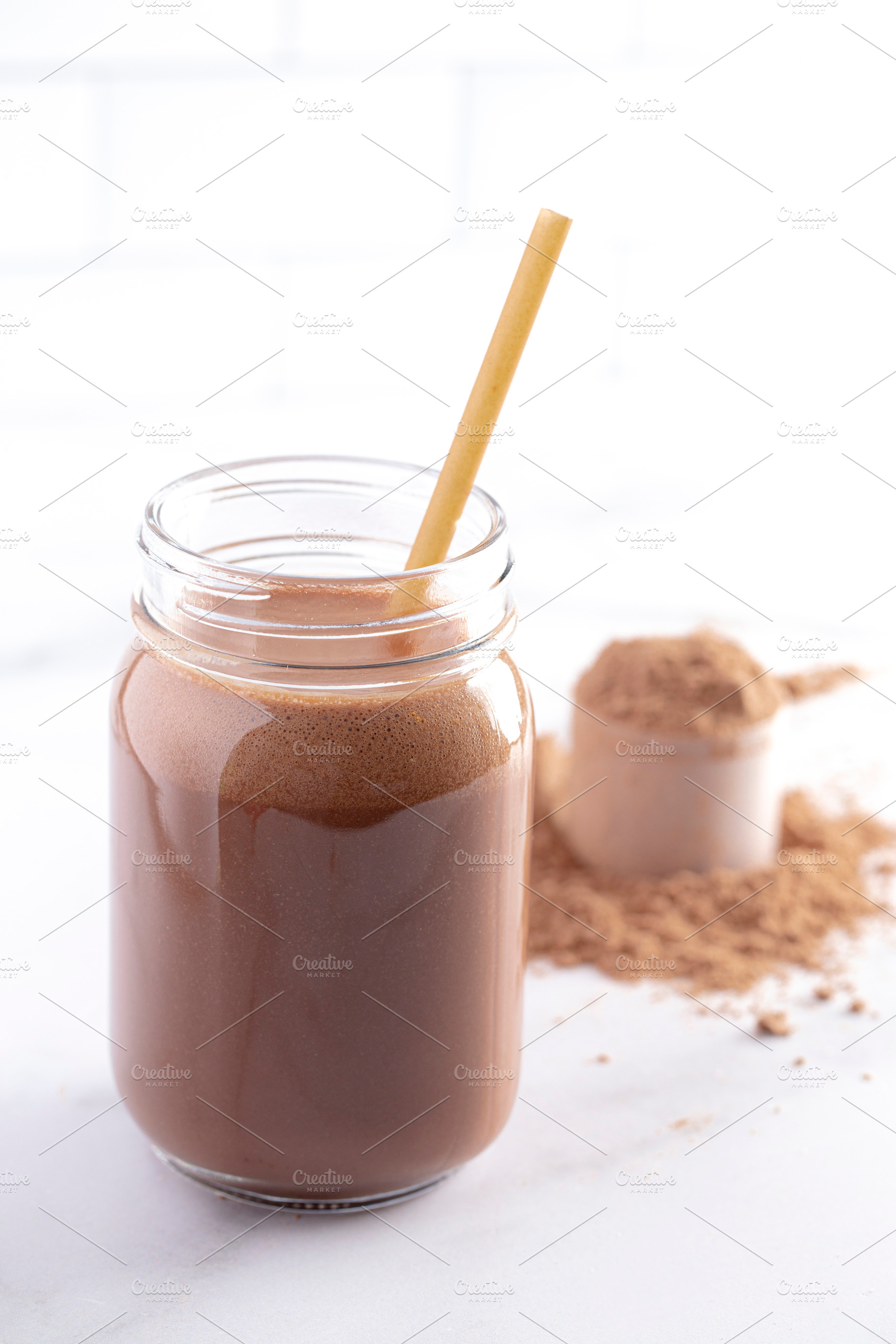 Chocolate Protein Powder Shake with Straw on a Kitchen Counter, a Food & Drink Photo by P Maxwell Photography