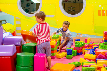 boys playing building toy blocks