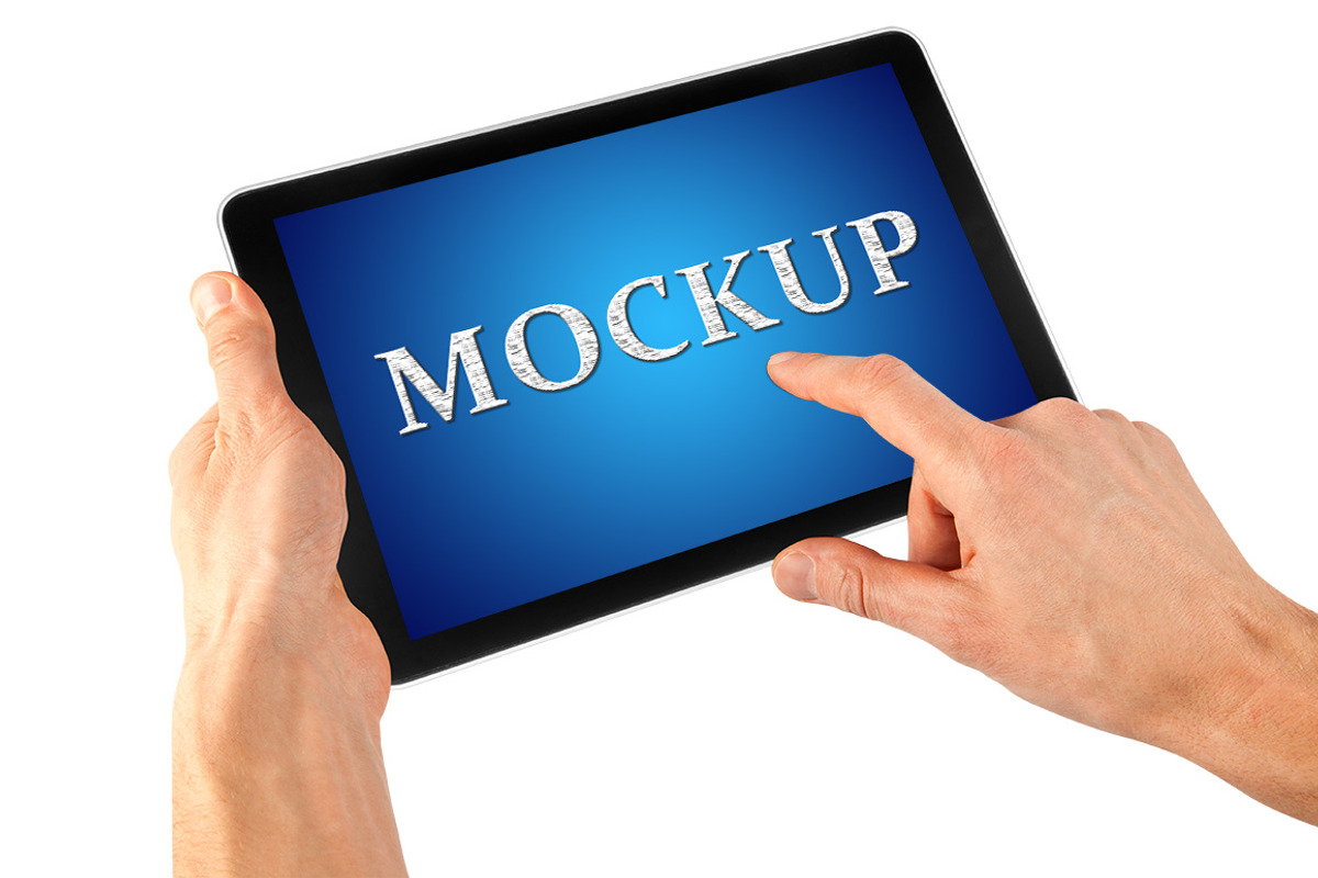 Tablet in a hand, an iPad Mockup by vovan