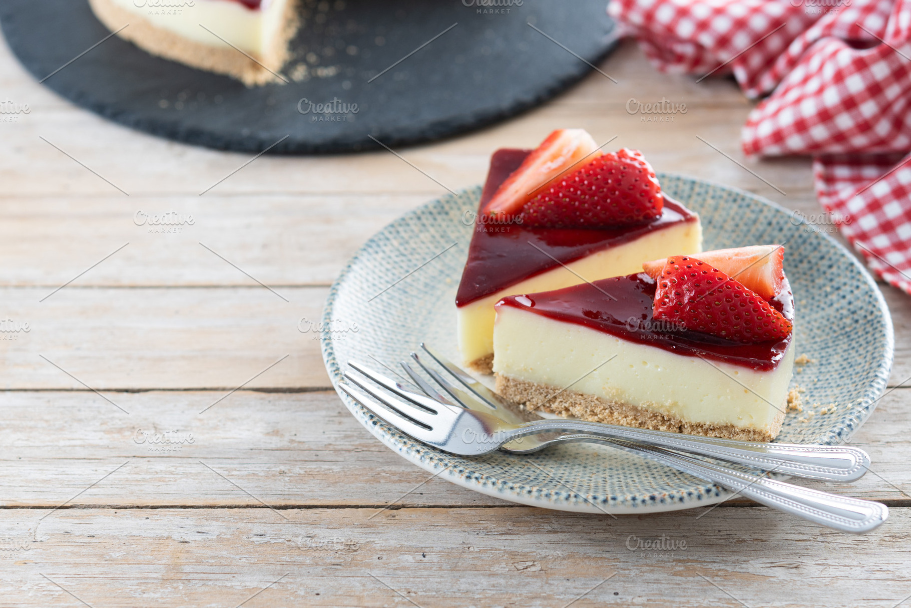 Cheesecake with strawberries on wooden table, a Food & Drink Photo by etorres69