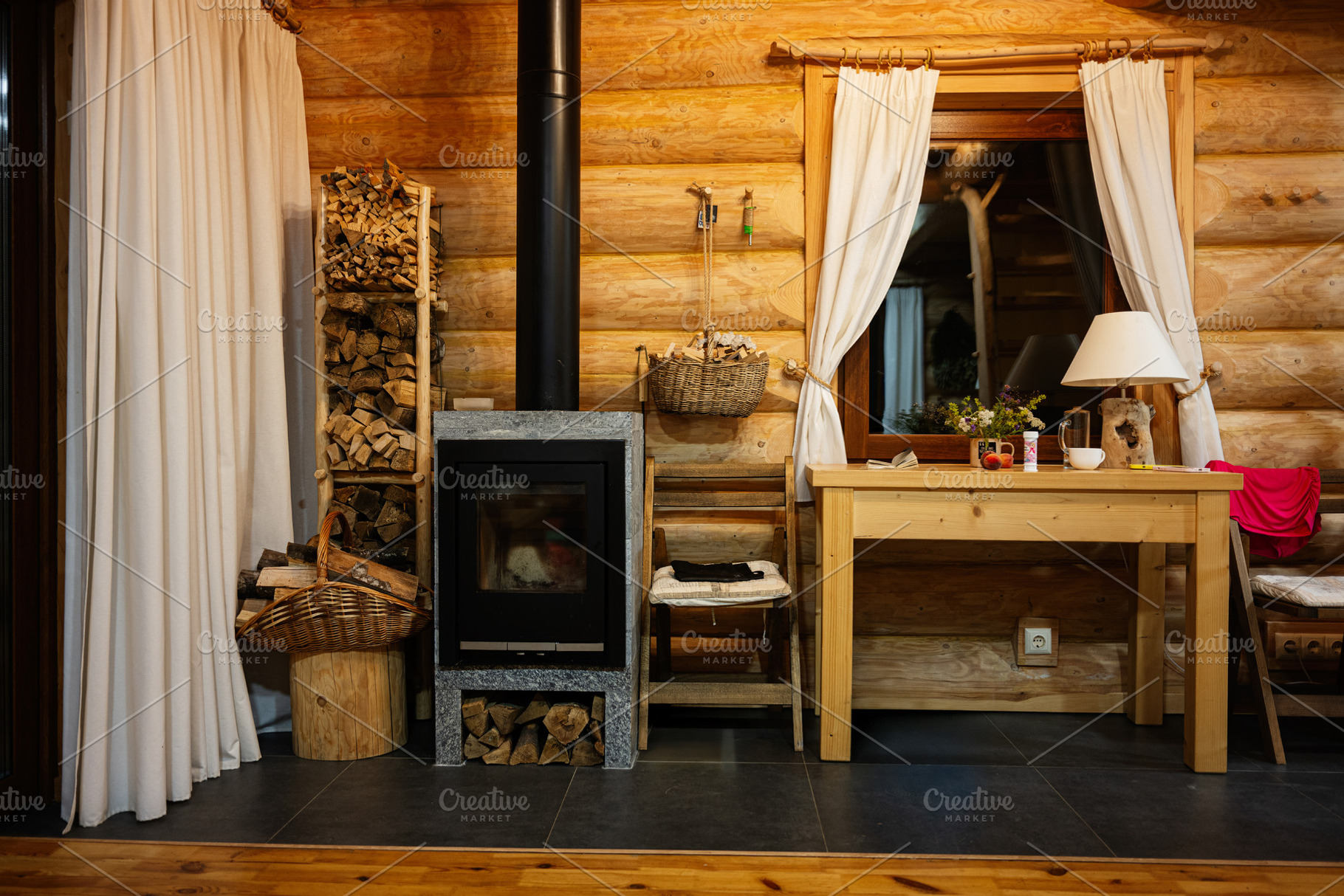 Cozy rustic living area with wood stack and fireplace for warmth, a Photo by AS photostudio