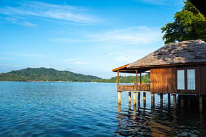 Sunset view of stilt house on Bolilanga Island, Togian archipela