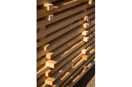 Wooden planks and beams at a outdoor, an Industrial Photo by volodymyrshtun13795