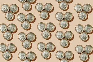 pattern of triangular groups of three food cans, a Photo by Nito