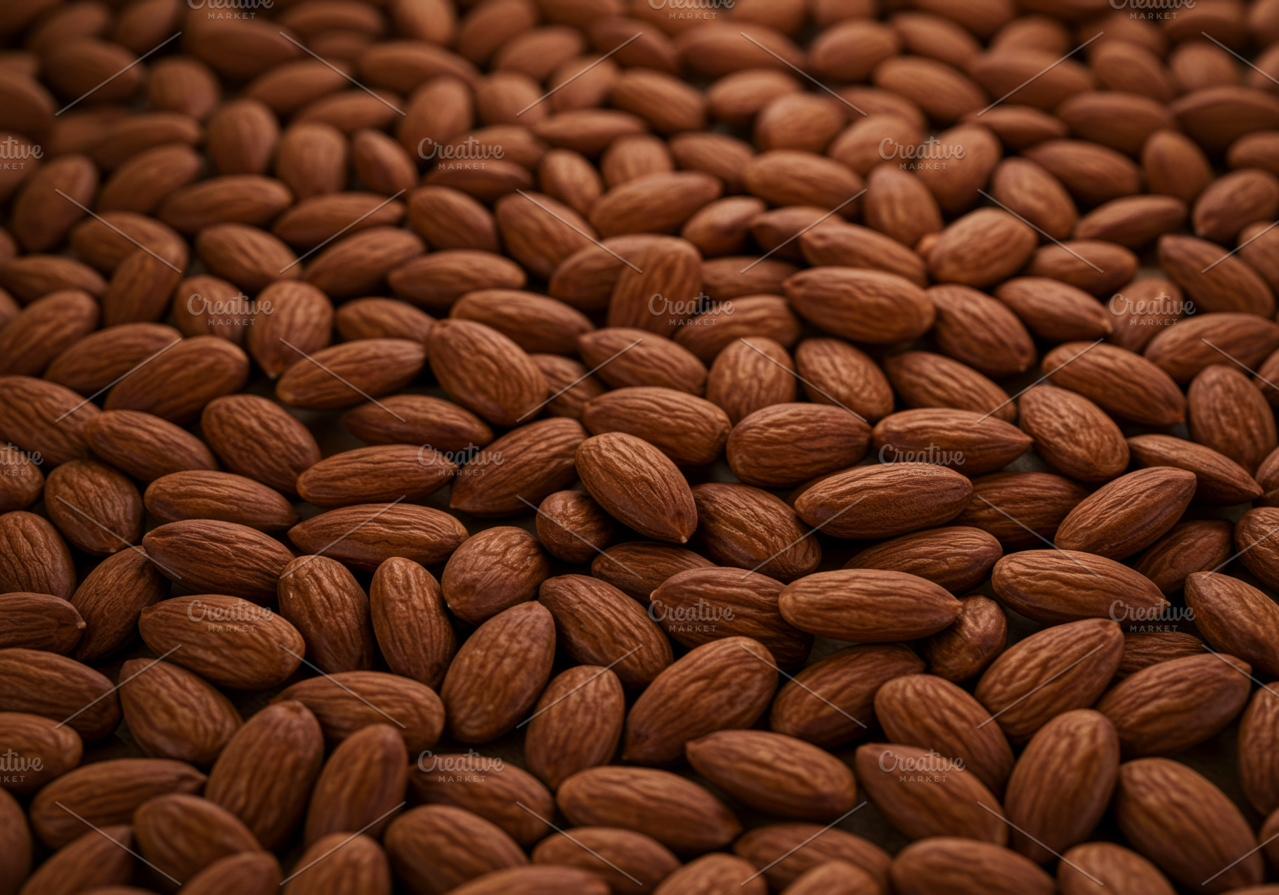 Close-up of raw whole almonds in a t, a Food & Drink Photo by professorinc