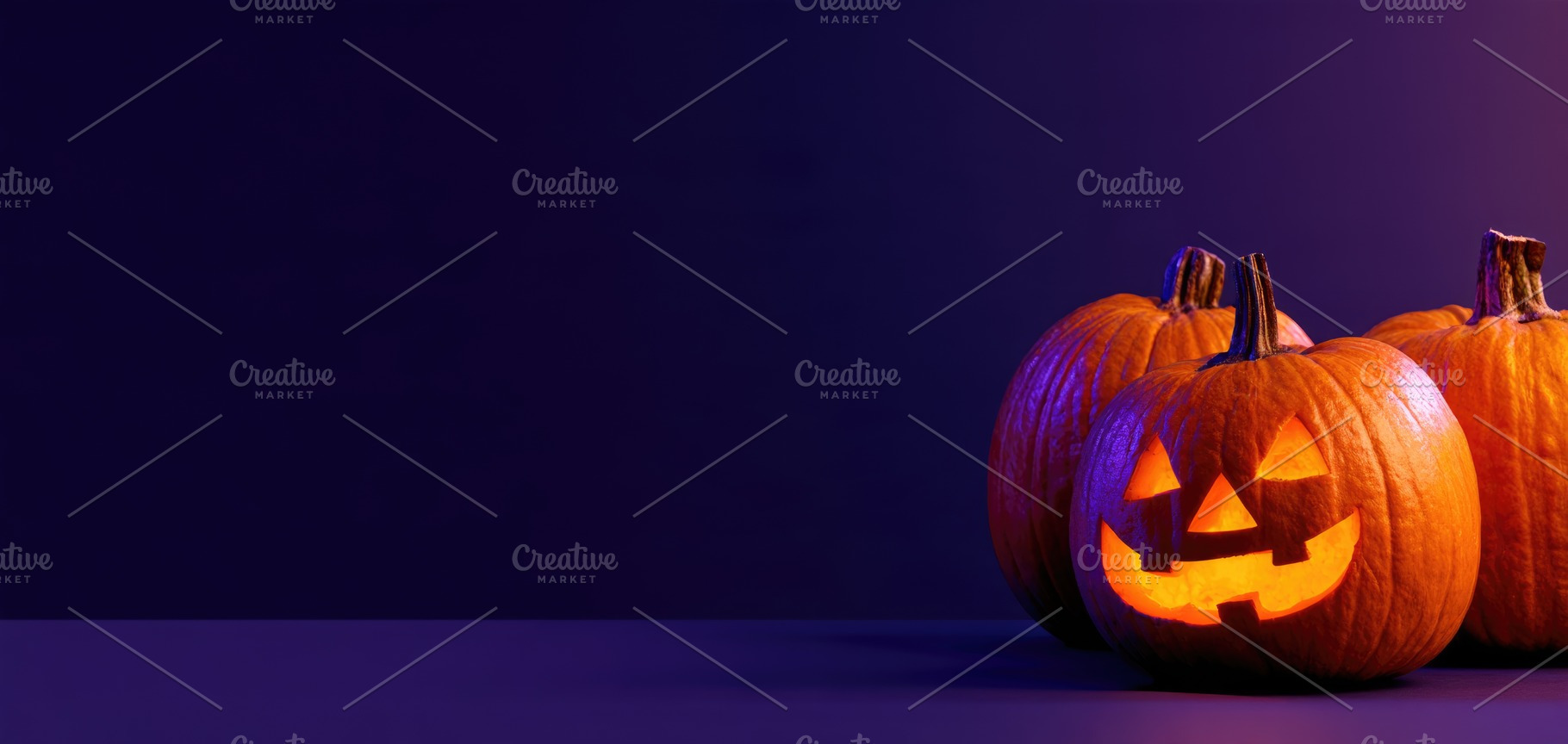 Halloween pumpkins and candy on purple copy space, a Person Photo by José Manuel Gelpi