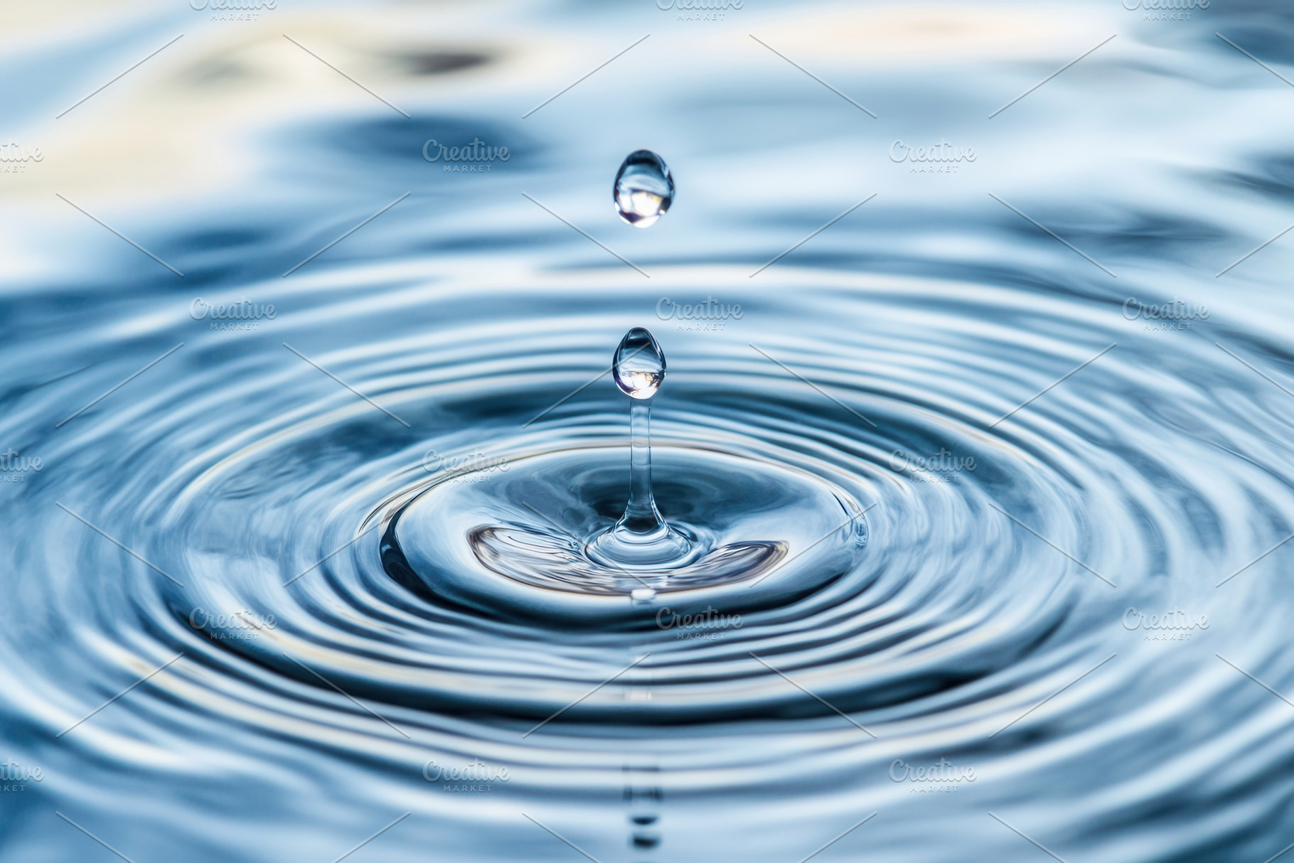 Droplet creates ripples of calm, a Photo by Pavel_design