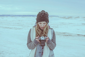 Woman with camera containing blonde hair, vintage camera, and beautiful