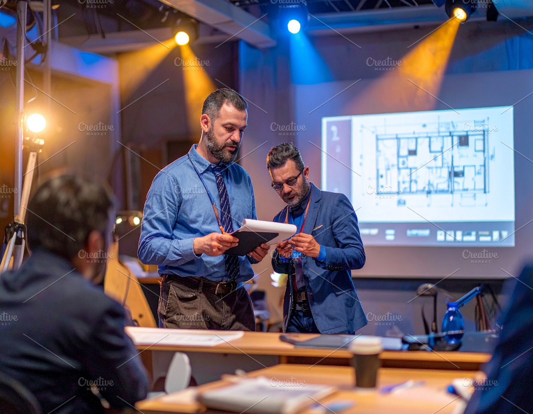 Jury and architects presenting projects and projections on scree, a Business Photo by DanFLCreativo